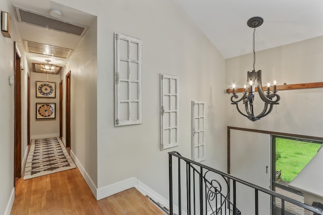16 Pond Crest Rd, Danbury, CT 06811 - corridor with a chandelier, an upstairs landing, and light wood-type flooring