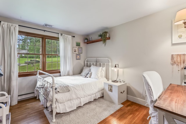 16 Pond Crest Rd, Danbury, CT 06811 - bedroom with a baseboard radiator and wood finished floors