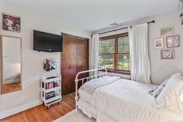 16 Pond Crest Rd, Danbury, CT 06811 - bedroom featuring wood finished floors, heating unit, and a closet