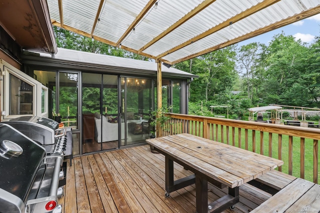 16 Pond Crest Rd, Danbury, CT 06811 - wooden deck with a sunroom, a grill, view of scattered trees, outdoor dining space, and a yard