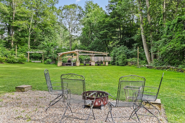 16 Pond Crest Rd, Danbury, CT 06811 - view of grassy yard featuring an outdoor fire pit