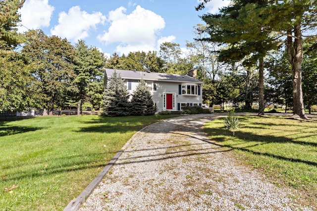 420 Newcomb Rd, North Kingston, Rhode Island, RI 02852 - split foyer home featuring a chimney, a front lawn, driveway, and view of wooded area