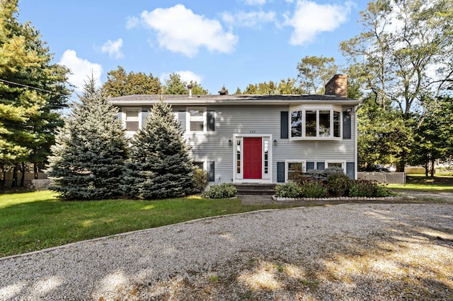 420 Newcomb Rd, North Kingston, Rhode Island, RI 02852 - bi-level home featuring a chimney and a front yard