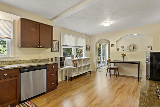 420 Newcomb Rd, North Kingston, Rhode Island, RI 02852 - kitchen featuring stainless steel dishwasher, arched walkways, light wood-type flooring, and light stone countertops