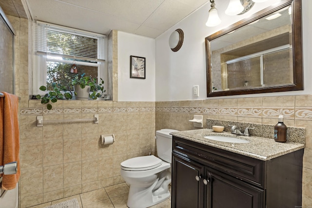 420 Newcomb Rd, North Kingston, Rhode Island, RI 02852 - full bathroom with tile walls, tile patterned floors, vanity, tiled shower, and wainscoting
