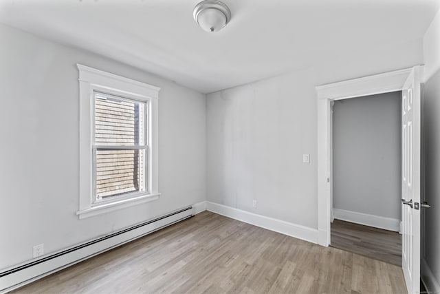36 Taylor Ave, Norwalk, CT 06854 - unfurnished room with a baseboard radiator and light wood-type flooring