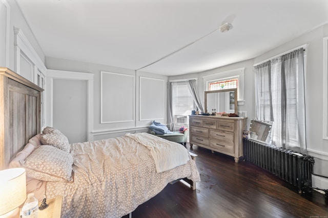 36 Taylor Ave, Norwalk, CT 06854 - bedroom with radiator heating unit and dark wood-style floors