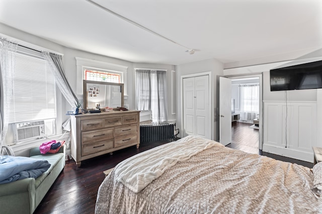 36 Taylor Ave, Norwalk, CT 06854 - bedroom featuring radiator heating unit, cooling unit, and dark wood-style floors