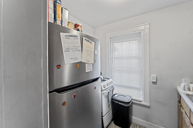 36 Taylor Ave, Norwalk, CT 06854 - laundry room featuring baseboards