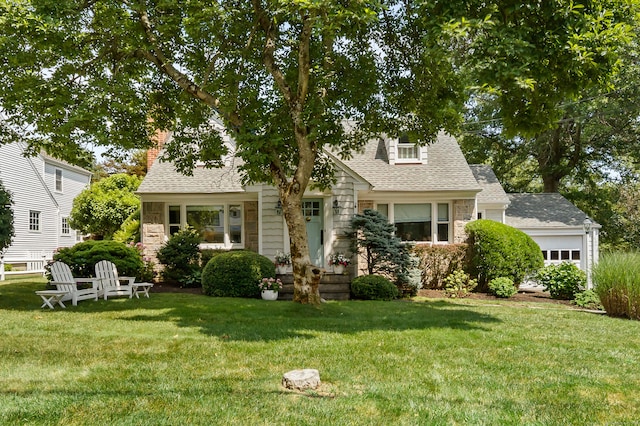 33 Ridgeley St, Darien, CT 06820 - view of front of home featuring stone siding, a front lawn, a shingled roof, and an attached garage
