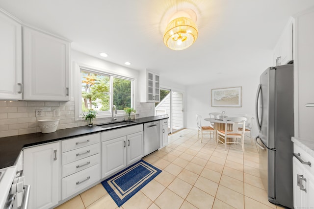 33 Ridgeley St, Darien, CT 06820 - kitchen featuring appliances with stainless steel finishes, light tile patterned floors, white cabinetry, and recessed lighting