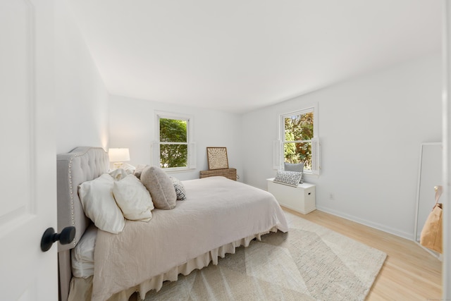 33 Ridgeley St, Darien, CT 06820 - bedroom featuring multiple windows and light wood-type flooring