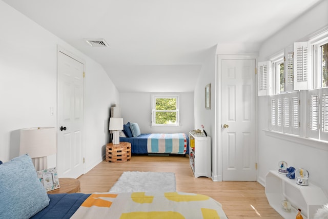 33 Ridgeley St, Darien, CT 06820 - bedroom with light wood-style flooring and lofted ceiling
