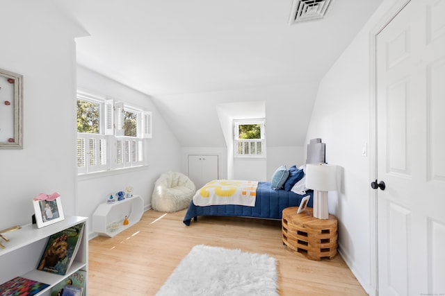 33 Ridgeley St, Darien, CT 06820 - bedroom featuring wood finished floors, multiple windows, and lofted ceiling