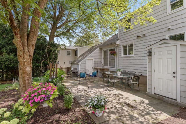 33 Ridgeley St, Darien, CT 06820 - view of patio featuring a grill and a storage unit