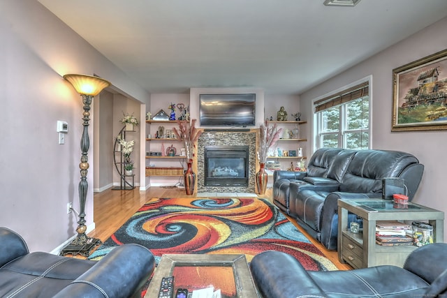 68 Benjamin Rd, East Haven, CT 06513 - living area with wood finished floors and a stone fireplace
