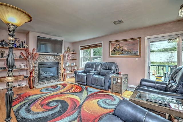 68 Benjamin Rd, East Haven, CT 06513 - living room with wood finished floors and a stone fireplace