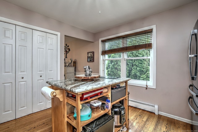 68 Benjamin Rd, East Haven, CT 06513 - dining space with baseboard heating and light wood-type flooring