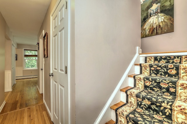 68 Benjamin Rd, East Haven, CT 06513 - staircase featuring a baseboard heating unit and wood-type flooring