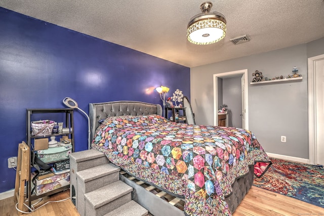 68 Benjamin Rd, East Haven, CT 06513 - bedroom featuring wood finished floors and a textured ceiling