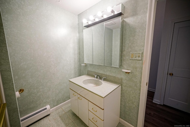 50 E Hill Rd Apt 2H, Canton, CT 06019 - bathroom featuring a baseboard heating unit and vanity