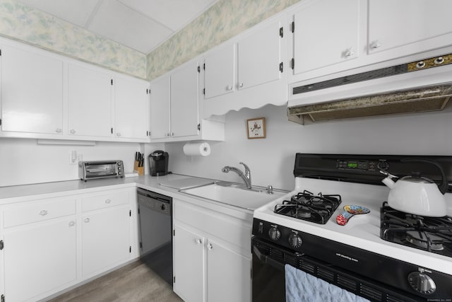 1176 Ocean Ave, New London, CT 06320 - kitchen featuring black appliances, ventilation hood, light countertops, and white cabinets