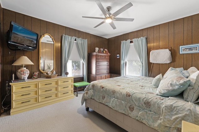 1176 Ocean Ave, New London, CT 06320 - bedroom featuring carpet flooring, multiple windows, wood walls, and ceiling fan