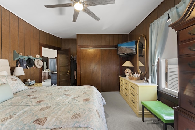 1176 Ocean Ave, New London, CT 06320 - bedroom with wooden walls, light colored carpet, a closet, and ceiling fan