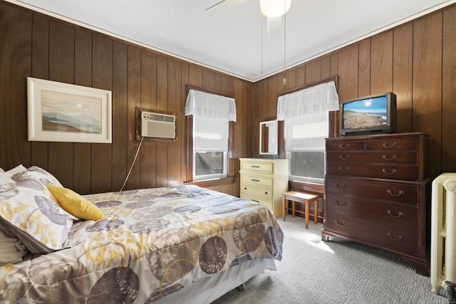 1176 Ocean Ave, New London, CT 06320 - carpeted bedroom with a wall unit AC, wooden walls, a ceiling fan, and radiator heating unit