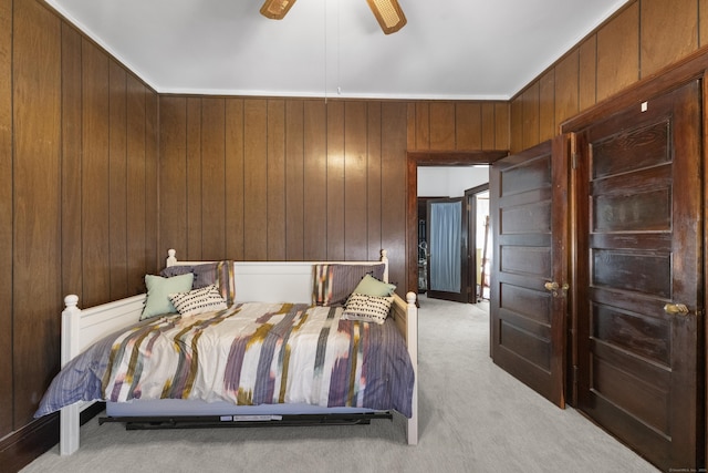 1176 Ocean Ave, New London, CT 06320 - bedroom featuring light colored carpet, wooden walls, and a ceiling fan