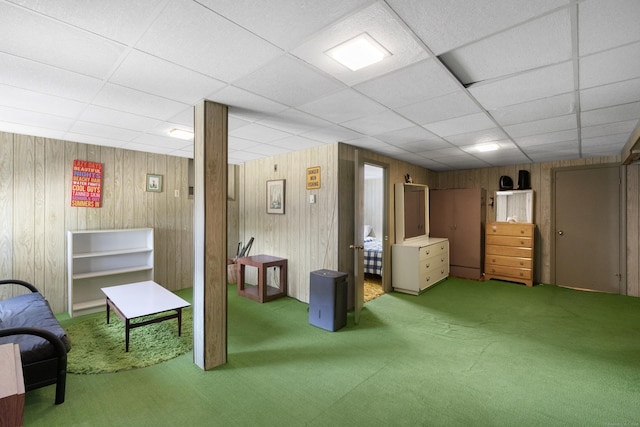 1176 Ocean Ave, New London, CT 06320 - below grade area with a paneled ceiling, carpet flooring, and wooden walls