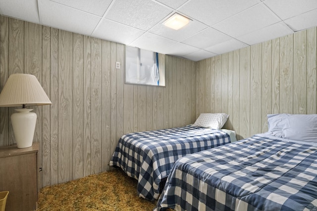 1176 Ocean Ave, New London, CT 06320 - bedroom featuring a drop ceiling, wood walls, and carpet floors