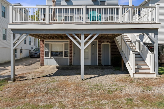 1176 Ocean Ave, New London, CT 06320 - rear view of property featuring a deck, board and batten siding, stairs, and a carport