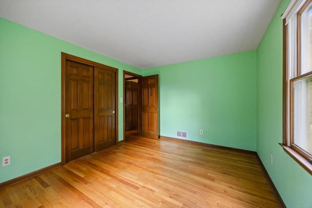 229 Flanders Rd, Southington, CT 06489 - unfurnished bedroom featuring light wood-style floors and a closet