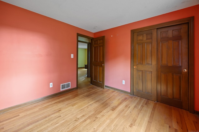 229 Flanders Rd, Southington, CT 06489 - unfurnished bedroom featuring light wood finished floors and a closet