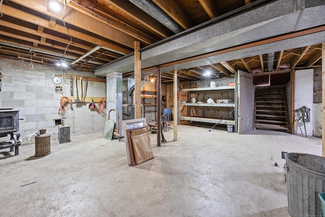 229 Flanders Rd, Southington, CT 06489 - unfinished below grade area featuring stairs and a wood stove