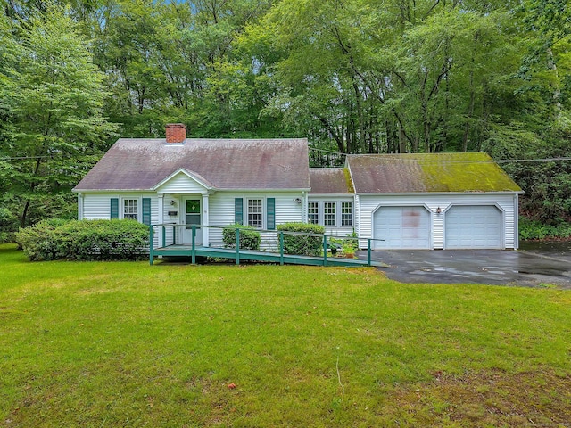 79 E Pattagansett Rd, East Lyme, CT 06357 - new england style home with driveway, a chimney, a garage, and a front yard