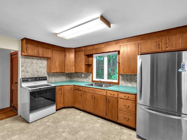 79 E Pattagansett Rd, East Lyme, CT 06357 - kitchen with freestanding refrigerator, electric stove, brown cabinetry, decorative backsplash, and open shelves