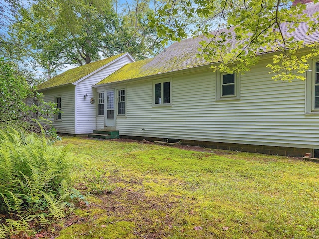 79 E Pattagansett Rd, East Lyme, CT 06357 - rear view of house featuring entry steps and a lawn