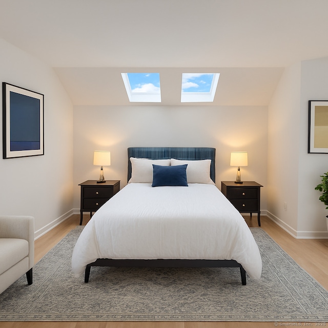 765 Durham Rd, Guilford, CT 06437 - bedroom with a skylight, light wood-type flooring, and vaulted ceiling
