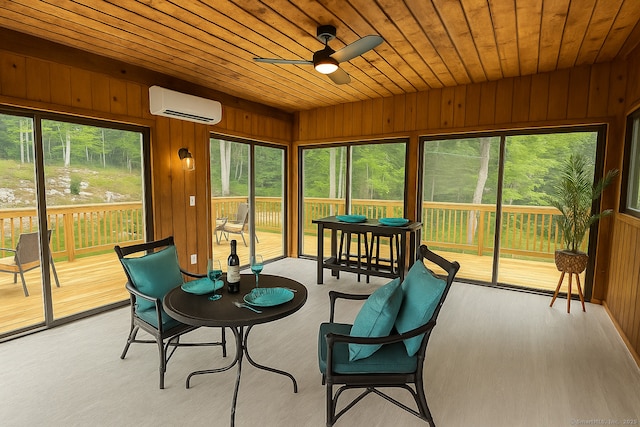 765 Durham Rd, Guilford, CT 06437 - sunroom featuring a wall mounted AC, a ceiling fan, a deck, wood walls, and wood ceiling