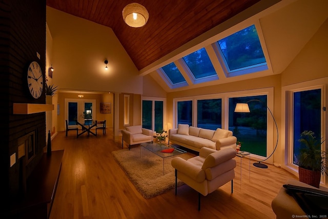 765 Durham Rd, Guilford, CT 06437 - living room with a skylight, high vaulted ceiling, wood finished floors, wooden ceiling, and a fireplace