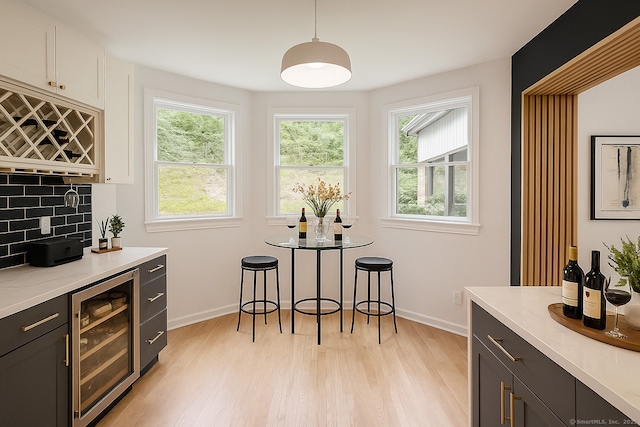 765 Durham Rd, Guilford, CT 06437 - indoor dry bar with beverage cooler, healthy amount of natural light, and light wood-style floors
