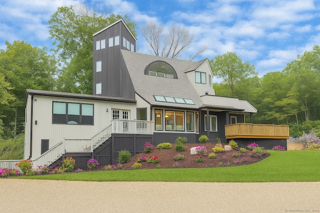 765 Durham Rd, Guilford, CT 06437 - view of front facade featuring a deck, roof with shingles, stairway, and a front yard