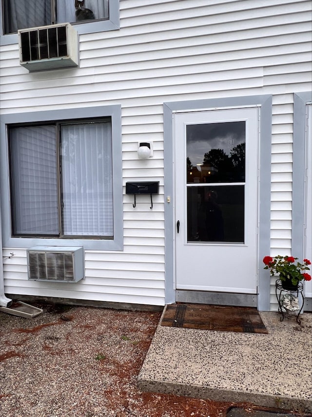 8 Hamre Ln Unit A, Branford, CT 06405 - property entrance with a wall unit AC