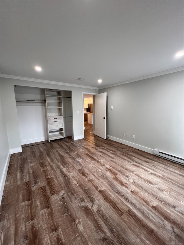 8 Hamre Ln Unit A, Branford, CT 06405 - unfurnished bedroom with a baseboard heating unit, crown molding, dark wood-type flooring, recessed lighting, and a closet