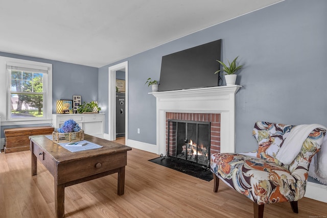 18 Lynde St, Old Saybrook, CT 06475 - living room with wood finished floors and a brick fireplace