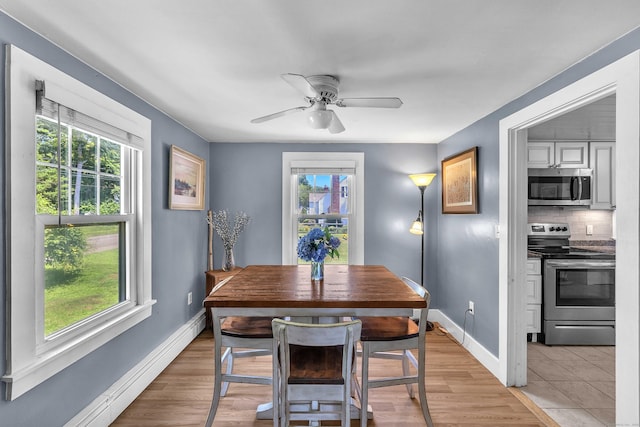 18 Lynde St, Old Saybrook, CT 06475 - dining area with healthy amount of natural light, baseboard heating, a ceiling fan, and light wood finished floors