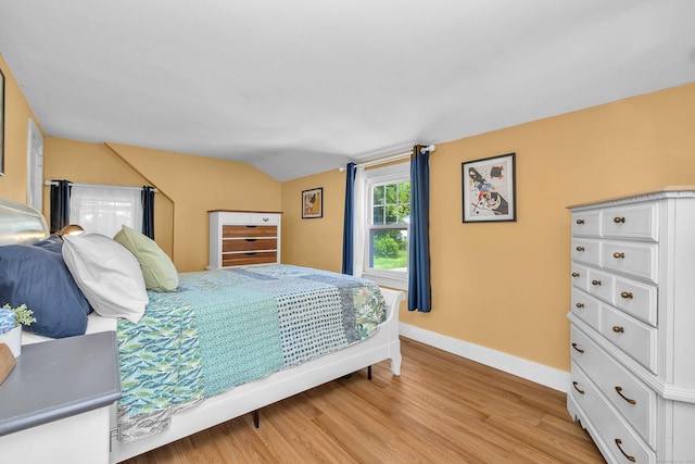 18 Lynde St, Old Saybrook, CT 06475 - bedroom featuring light wood-type flooring and vaulted ceiling