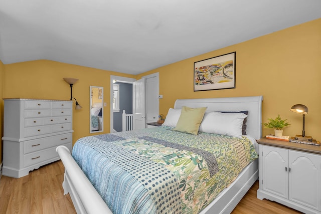 18 Lynde St, Old Saybrook, CT 06475 - bedroom with light wood-style flooring and vaulted ceiling